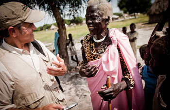 George Clooney speaks with an elderly woman in southern Sudan (Credit: Enough Project/Tim Freccia) George Clooney in southern Sudan with an elderly woman. Photo by Enough Project/Tim Freccia.